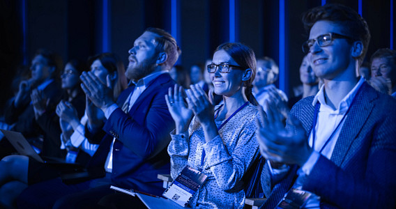 Audience clapping at event
